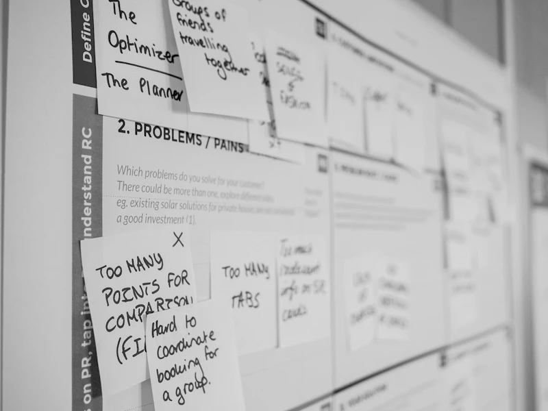 A wall covered in printed notes and sticky notes from a workshop